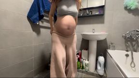 who is spying on a pregnant woman in the toilet?
