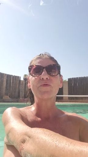 Naked Milf smoking in swimming pool
