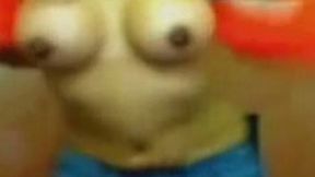 Just a latina on webcam with seemingly fake titties