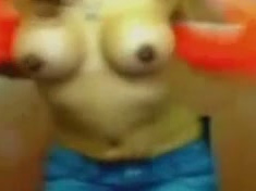 Just a latina on webcam with seemingly fake titties