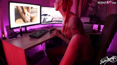 Tattooed German redhead Anni Angel teases solo on webcam while watching lesbian scenes
