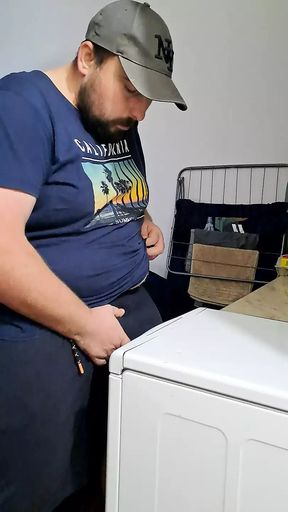 sexy bearded guy makes a dishwasher for him to rub his cock