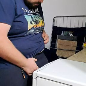 sexy bearded guy makes a dishwasher for him to rub his cock