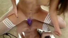 Awesome long-haired girl plays with a dildo in the bathroom