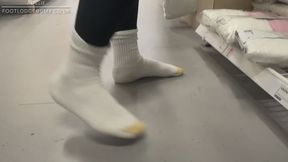 Amelie goes shopping in her white socks and no shoes