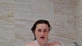 Girl loves her pussy and shows off big tits in the shower
