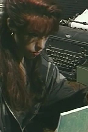 Lesbo lovers kiss each other on top of the table