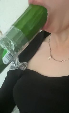 Sucking a cucumber