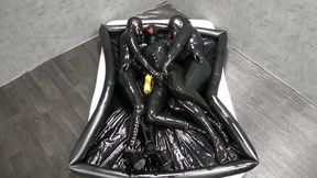 Rubber dolls cuddle in oily latex