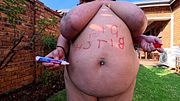 Smoking naked outside, displaying my fat brown body, body writing