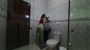 Maid changing clothes in the bathroom.