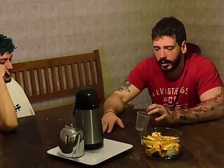 The wife returned early and saw her husband being suckled by his best friend.