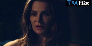 Darkness devils devour Danielle Cormack's succulent breasts under neon lights