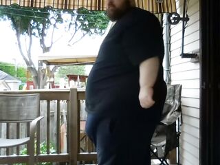 Plump dudes sitting outside pleased