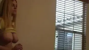 Amateur blonde babe Barbi displays off her big tits in a seductive photo shoot