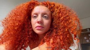 Naughty redhead squirts all over the bed