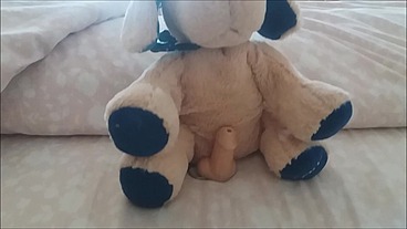 the m. plays with her feet on her puppy