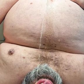 Bearded chub pissing in his mouth