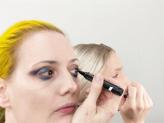 Sissy Bailey Wilde and Woman Putting On Makeup