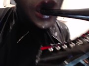 Sucking and spitting heels and dildo in silicone mask and black nylon encasement