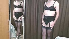 Crossdresser posing wearing Black Marie-Jo lingerie garter set.