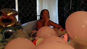 Chubby blonde strips and pops balloons while smoking