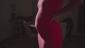 Very bloated in a pink dress