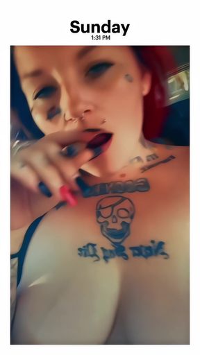 Busty tattooed babe shows off her natural big nipples with a nipple piercing