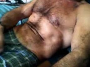 Bearded daddy strokes his cock solo