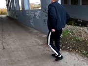 guy jerks off his dick under a traffic junction