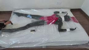 Latex ballet shoe doll in a vacuum bed