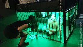Puppy training and feeding a slave in cage