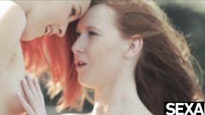 ”Watch these two hot redheads have wild lesbian sex on the beach”