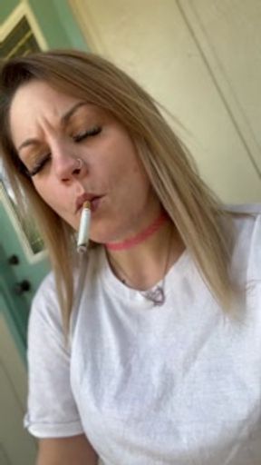 Hot babe dangling her morning cigarette