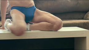 on the table again in tight briefs using volleyball for muscle compression and myofascial unwinding - slowed time lapse - try it at double speed too!