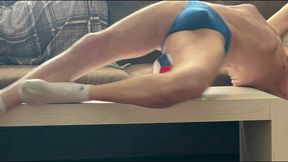 on the table again in tight briefs using volleyball for muscle compression and myofascial unwinding - slowed time lapse - try it at double speed too!