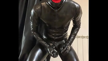 Masturbating in total black latex