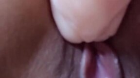 Close up fucking a perfect looking cunt with a dildo. At the same time a vibrating toy is stimulating the clitoris.