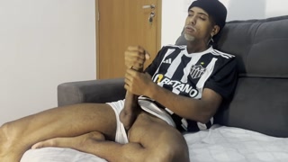 Masturbating his huge cock