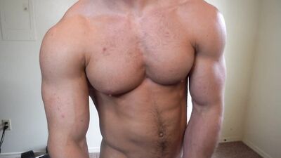 Handsome bloke is stroking his willy in front of the camera