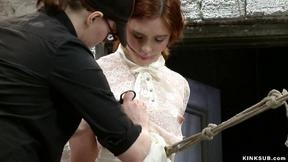 ”Bound redhead zappered on hogtie”