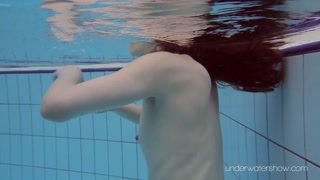 White swimsuit with tattoos babe Roxalana Cheh underwater