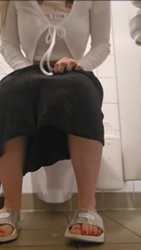 Pissing in public toilet with other woman