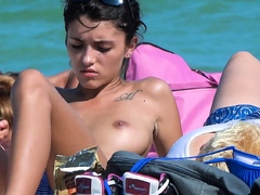 Gorgeous single brunette shows off her tits in public