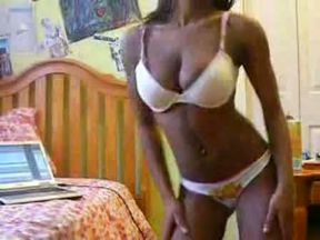 Fantastically seductive black bombshell dances and strips on webcam