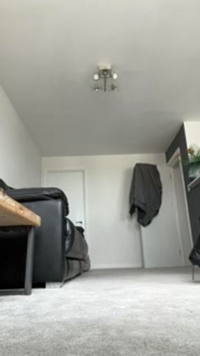 Petite brunette slides on her seamed stockings and leather boots for you