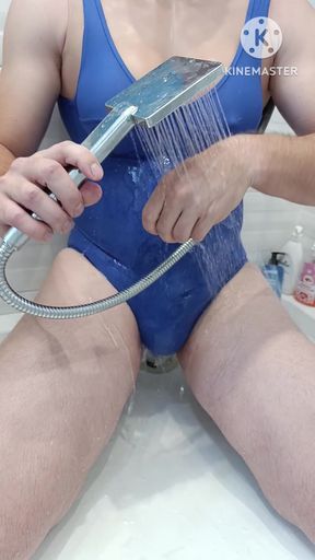 tranny in sexy blue swimsuit piss and jerking and get shower