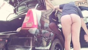 naked man cleaning car