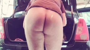 naked man cleaning car
