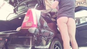 naked man cleaning car